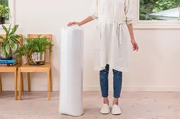 圧縮梱包による輸送効率の向上とCO2削減