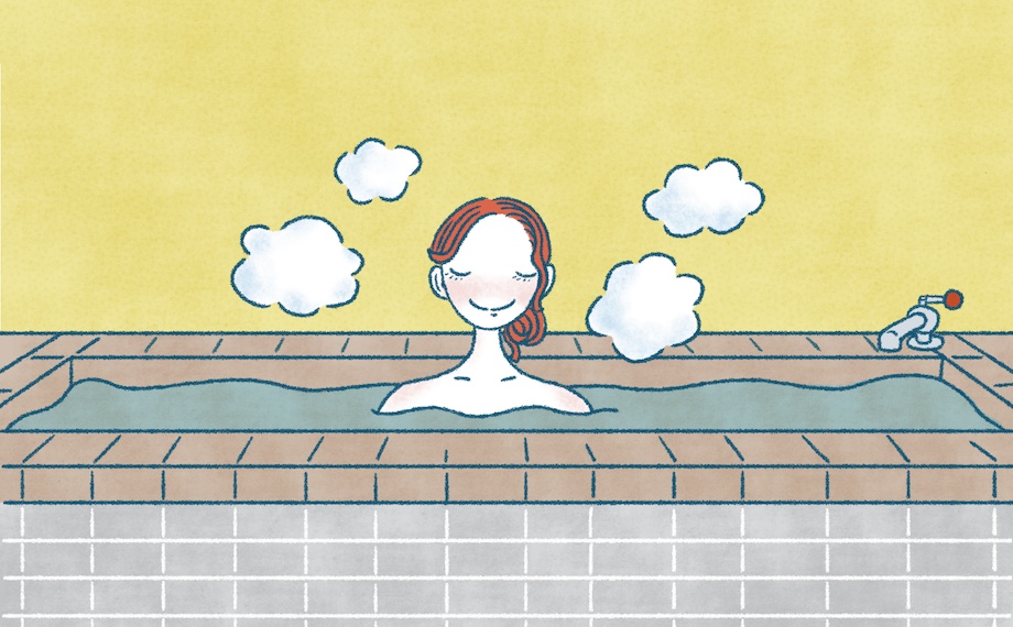 女性が銭湯で浴槽に浸かっている様子