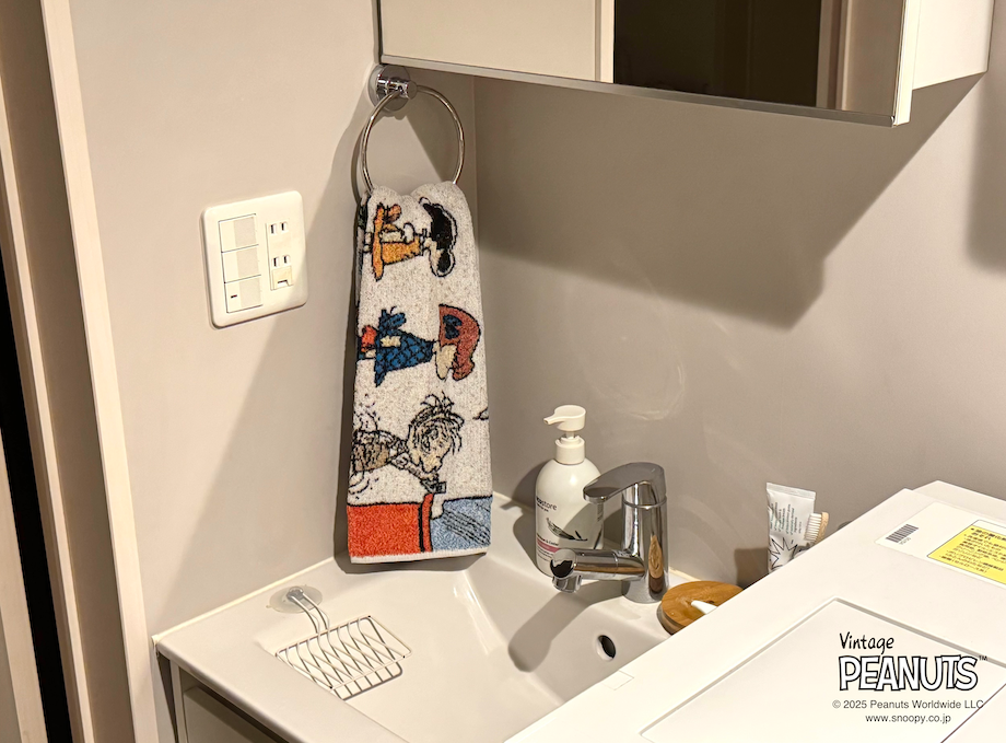 洗面台でピーナッツデザインのタオルを使用した写真